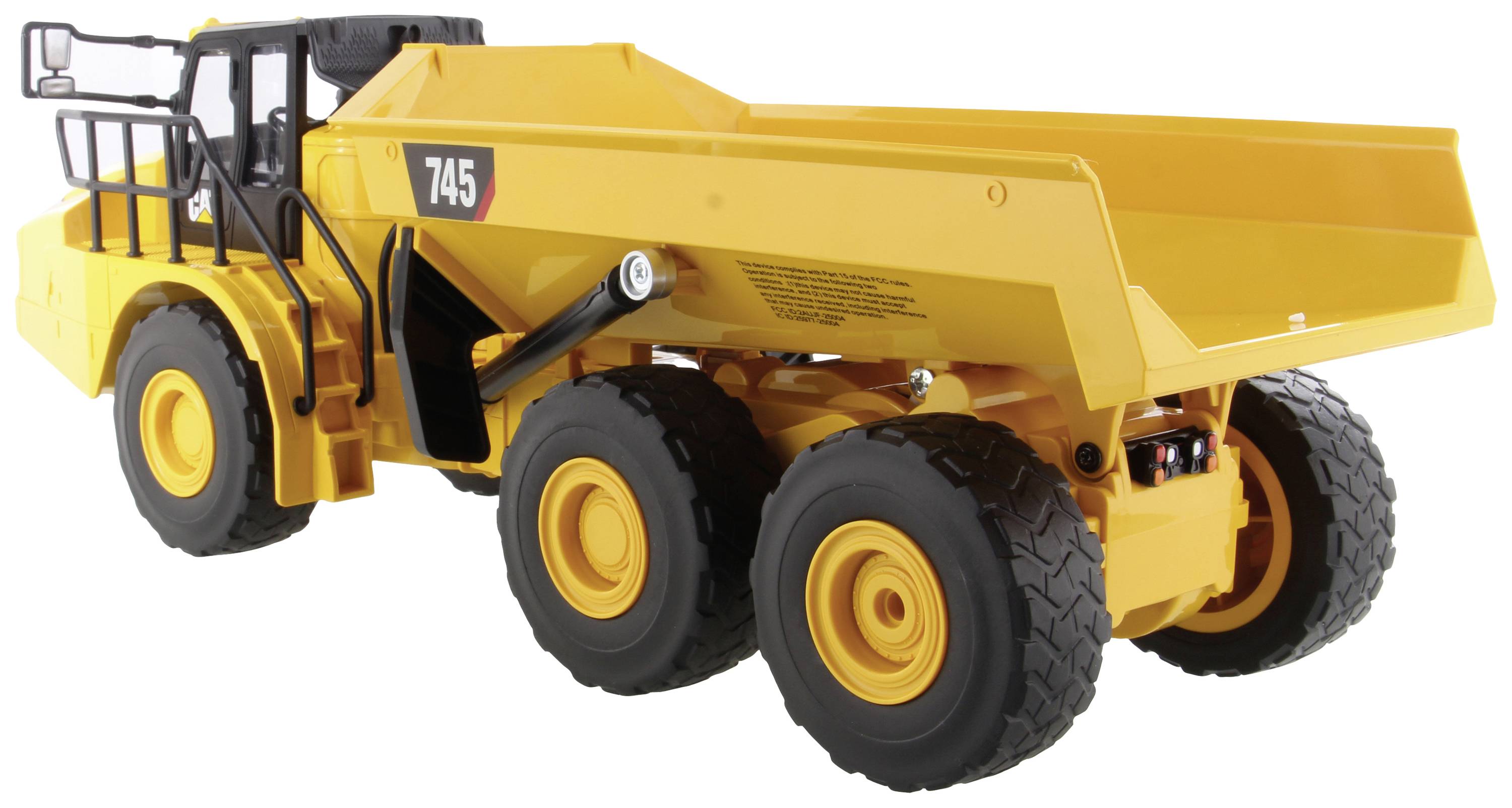 En gul dumptruck med seks store hjul, sort rækværk og nummeret '745' på siden, på hvid baggrund.