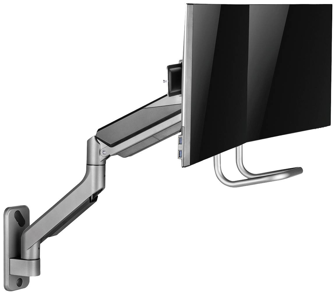En skærm på en svingbar vægarm med USB-porte, der muliggør fleksibel placering og pladssparende montering.