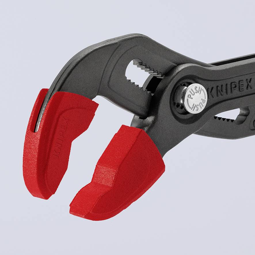 Rød og sort tang fra Knipex med justerbare kæber og ergonomisk greb, foran en grå baggrund.