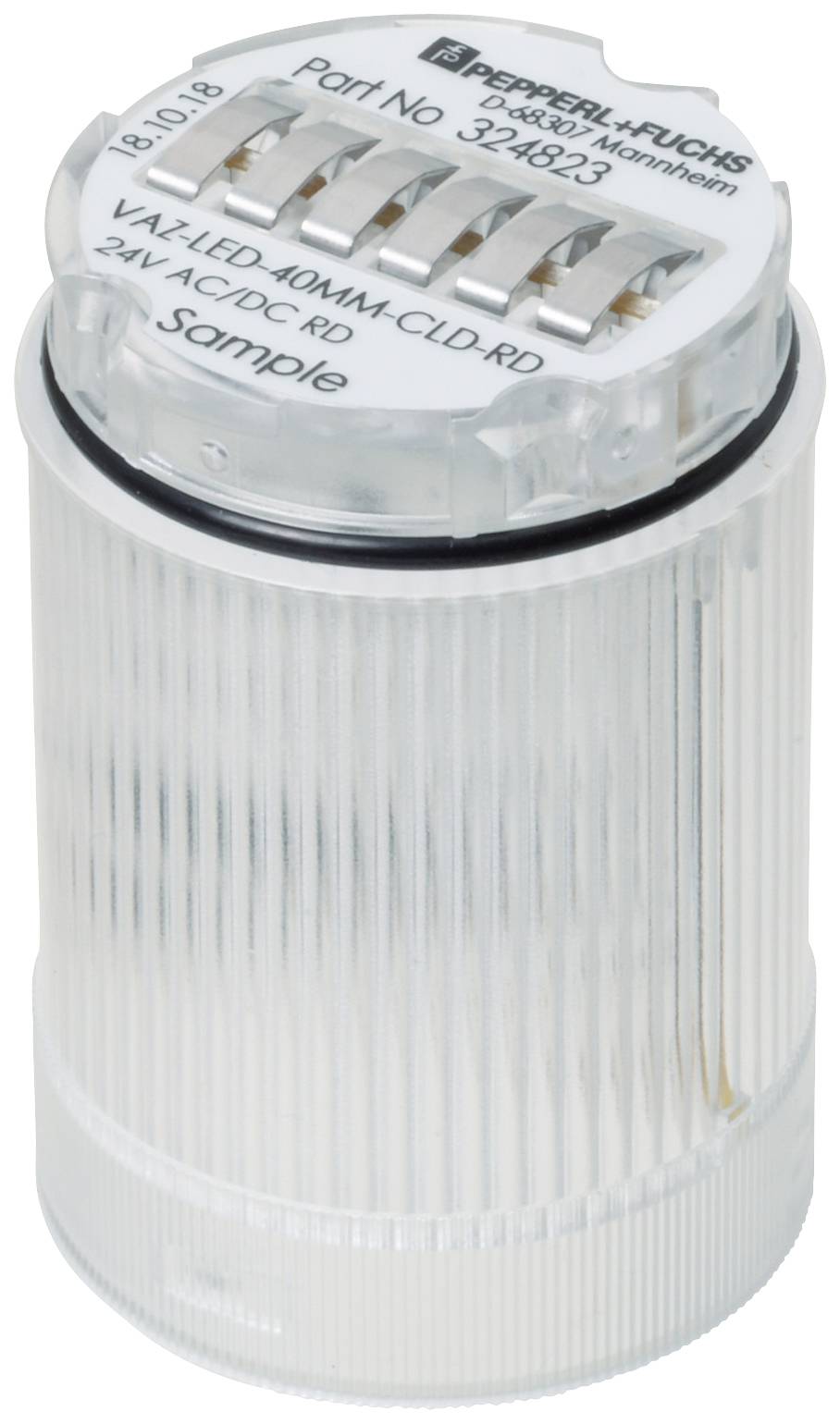 En gennemsigtig, cylindrisk LED-lampe med påskriften 'Part No 324823'. Øverst er metalcontakter synlige, hvorunder der står 'Sample'.