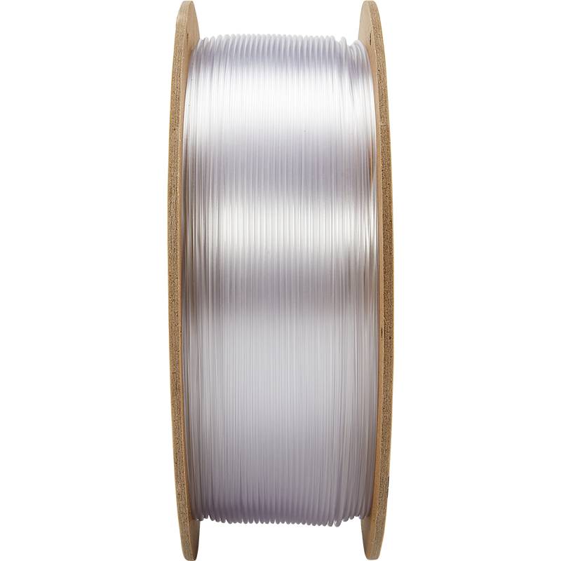 Skyllevand med gennemsigtigt 3D-printer-filament, viklet op på en træspole.