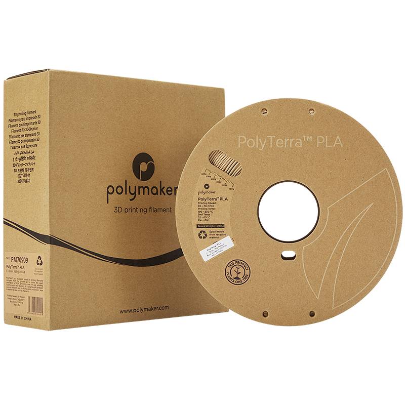 En emballage og en rulle filament til 3D-printer fra Polymaker, mærket 'PolyTerra PLA'. Genanvendelig, miljøvenlig.