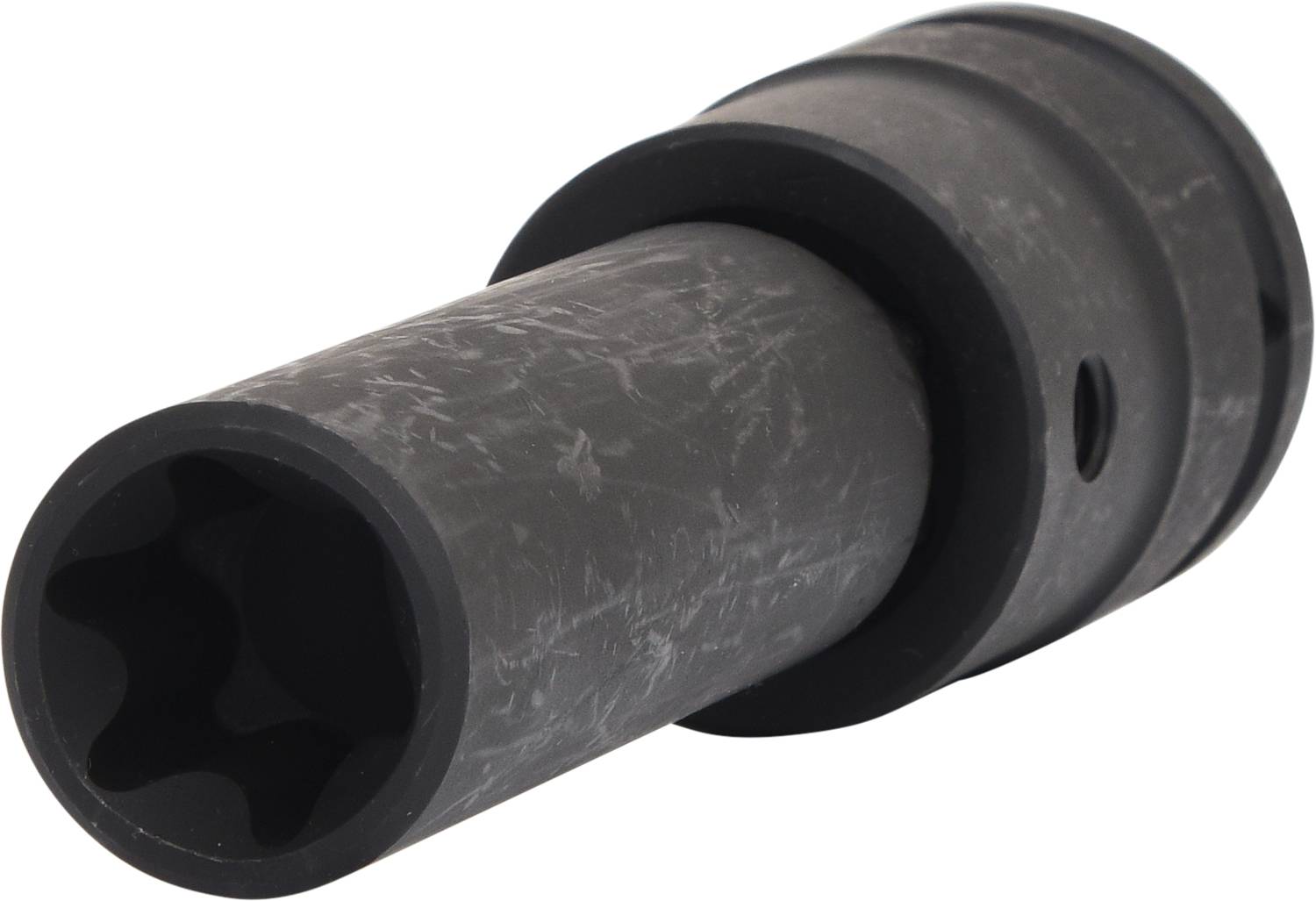 Billede af et mørkegrå, cylindrisk metalstykke med flere afsatser og et hul i siden, formentlig et værktøjstilbehør.