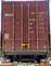 En rød containerdør med tekst om vægtdata: MAX.GROSS 30.480 KGS, TARE 2.220 KGS, NET 28.260 KGS, CU.CAP. 33.2 CUM.