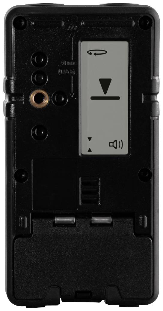En sort elektronisk enhed med et display, der viser en nedadrettet pil og et højttalersymbol. Oversiden har flere tilslutninger.