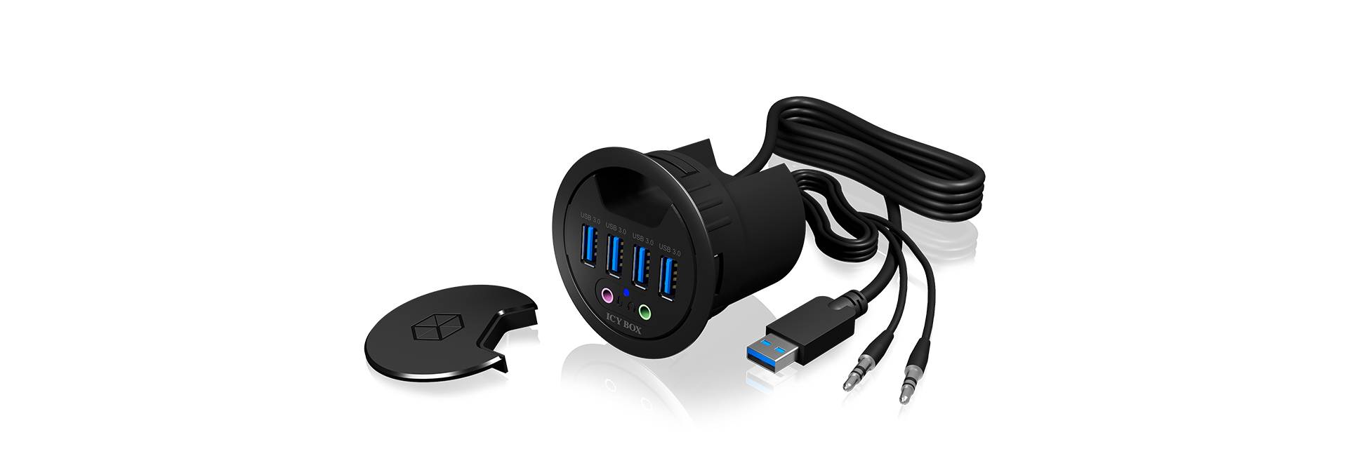 USB-hub i cylinderform med fire blå USB-porte og to runde lydstik. Kabler er fastgjort, låg ligger ved siden af.