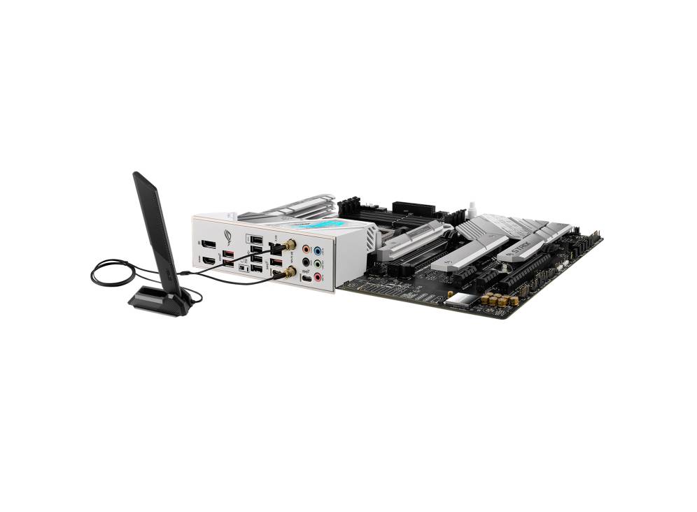 Et computer-bundkort med flere tilslutninger er forbundet med en hvid enhed, ved siden af en lodret stående antenne.
