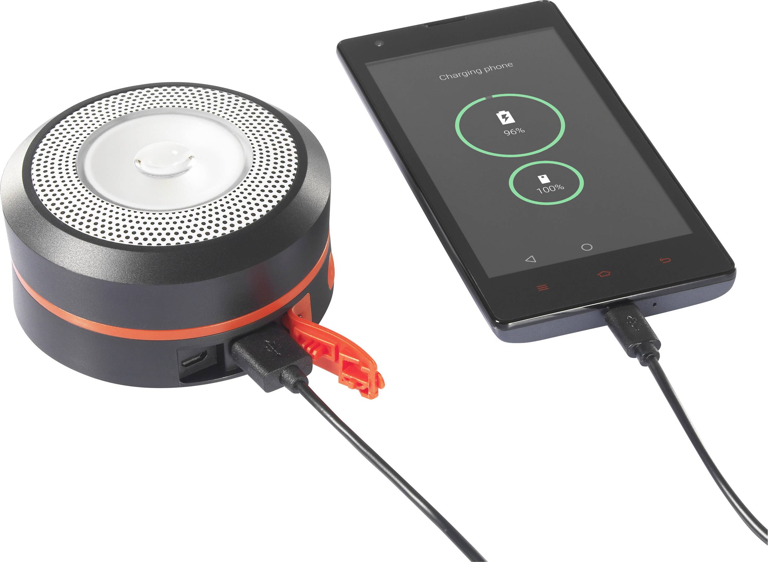 En smartphone oplades via et kabel fra en rund, bærbar højttaler. Skærmen viser 'Charging phone'.