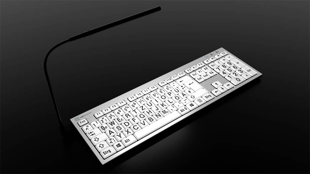Et fladt tastatur med hvide taster ligger på en mørk baggrund. Tasterne er arrangeret i QWERTZ-layout.
