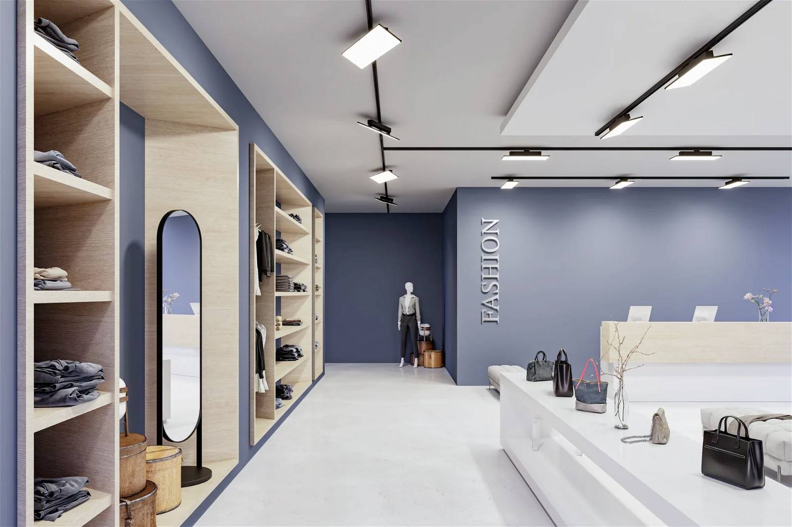 Et moderne designet butikslokale til modetøj med hylder fyldt med tøj, et spejl og tasker på disken. I baggrunden står en mannequin.
