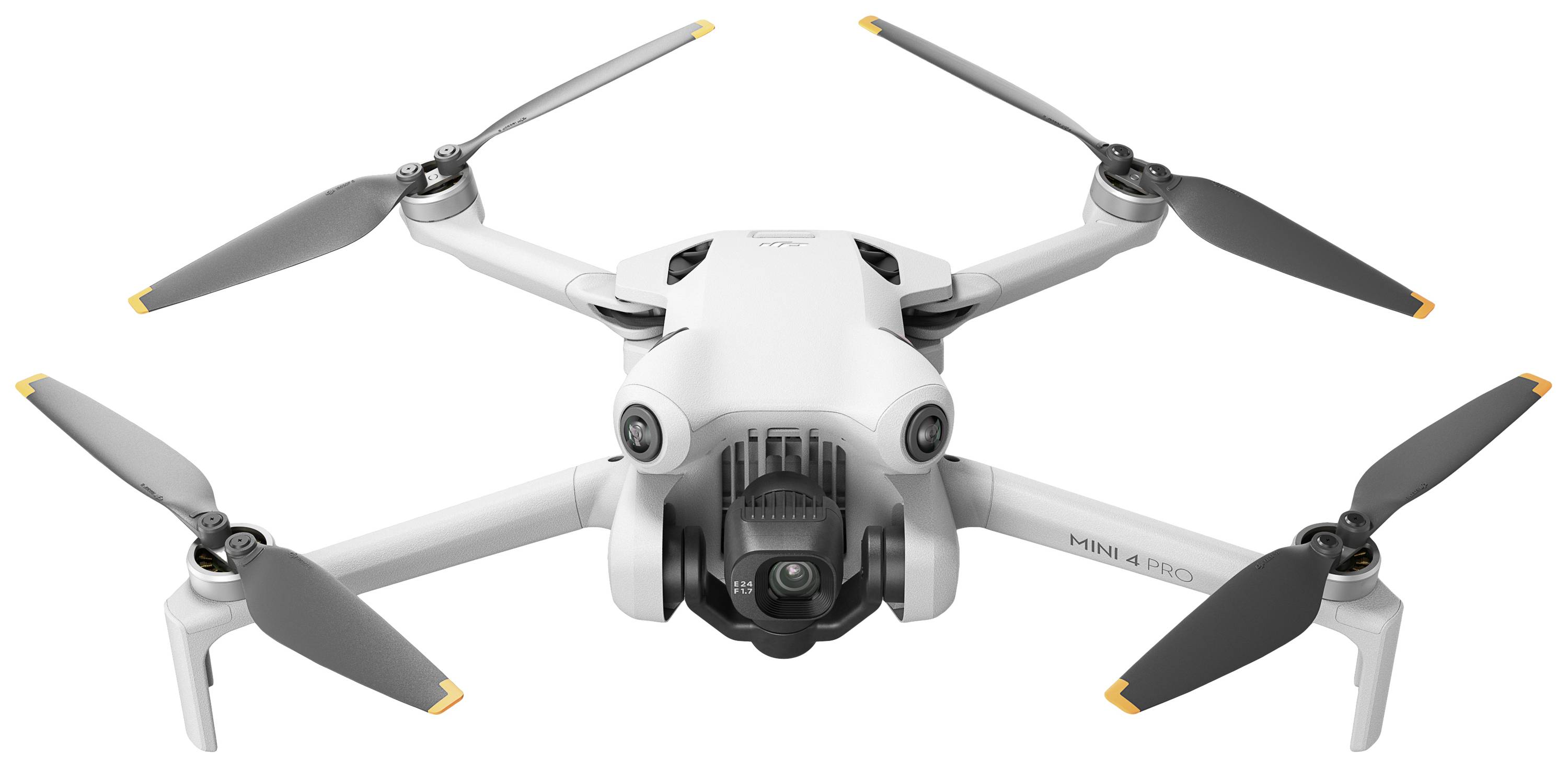 Hvid drone med fire rotorer i luften, kameramodul synligt forfra.