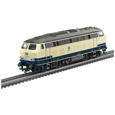 Diesel-lokomotiv fra DB med creme- og blå bemaling på et spor. Modelnummer på siden: '218 469-5'.