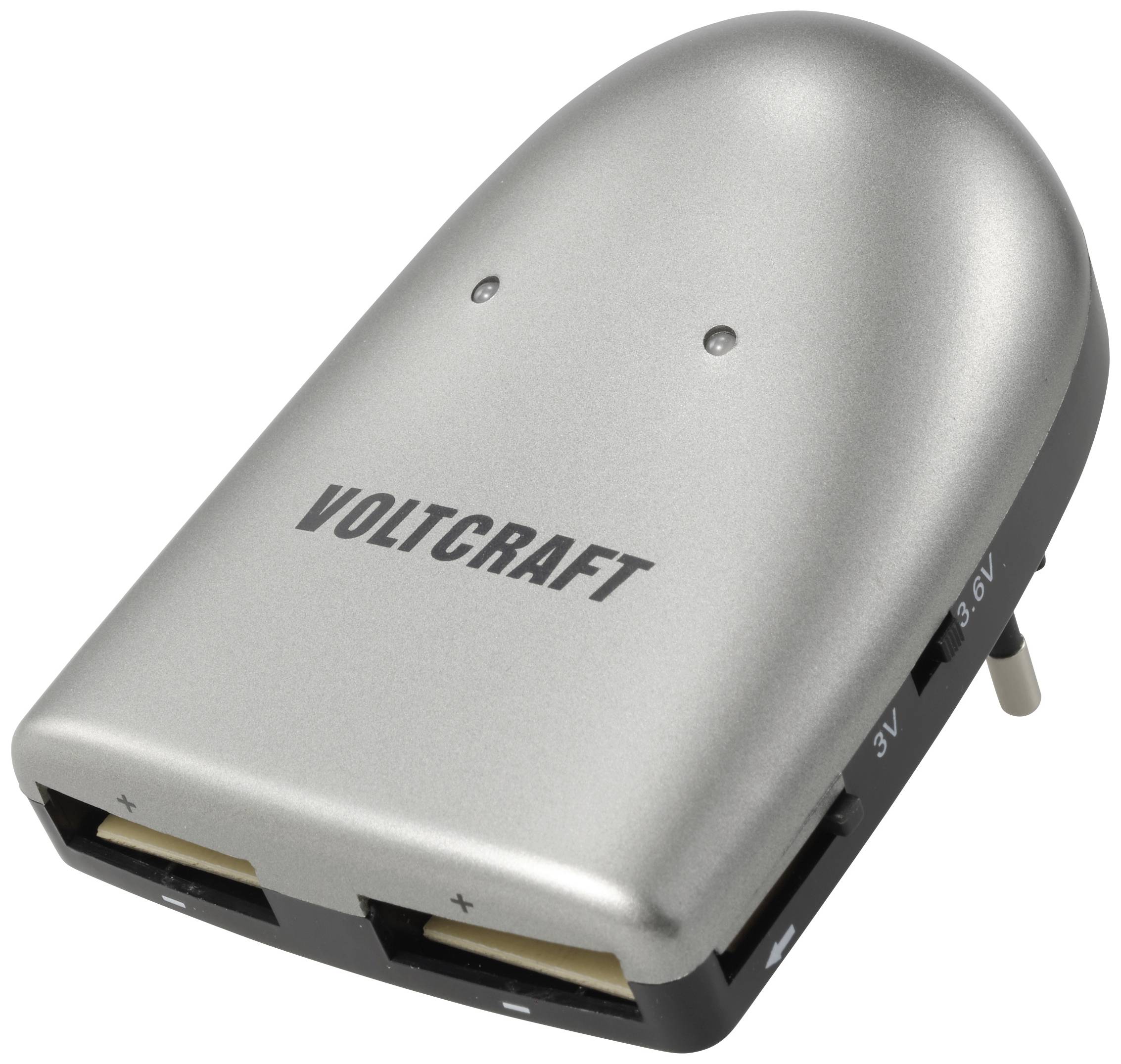 Sølvfarvet oplader fra Voltcraft med flere spændingsindstillinger og kabelstik. Ideel til elektroniske enheder.