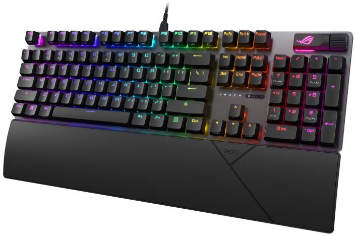 Sort gaming-tastatur med farverig RGB-bagbelysning og aftagelig håndledsstøtte på hvid baggrund.