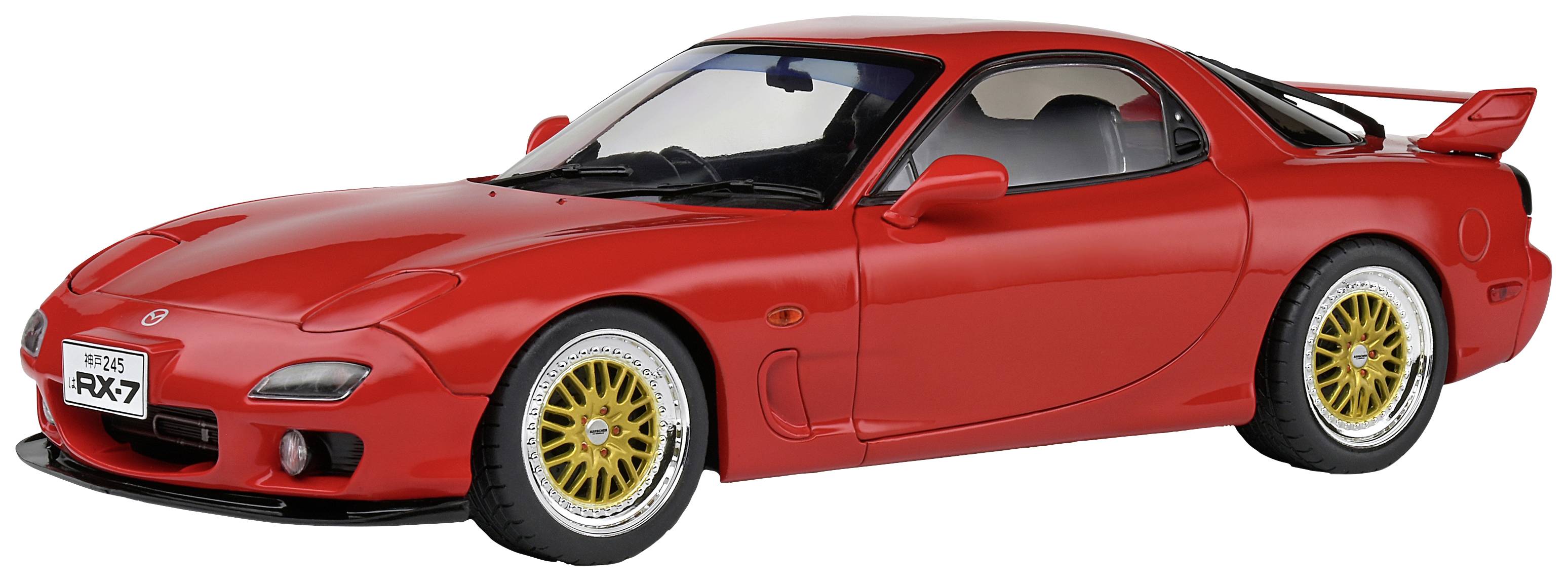Rød sportsvogn, set forfra: en Mazda RX-7 med markante gule fælge og et sportsligt design.