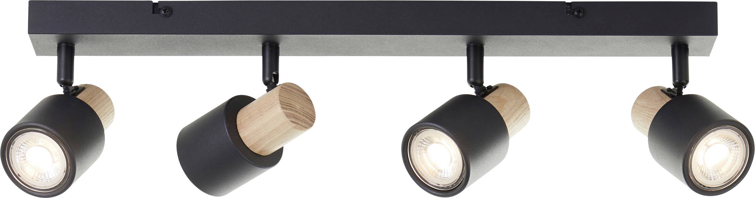 Sort loftlampe med fire justerbare spots, hver kombineret med træelementer, som udsender et varmt lys.