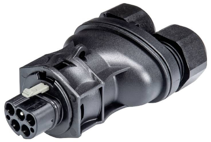 En sort elektrisk stik med flere runde tilslutninger, egnet til industrielle anvendelser, ligger på en glat overflade.