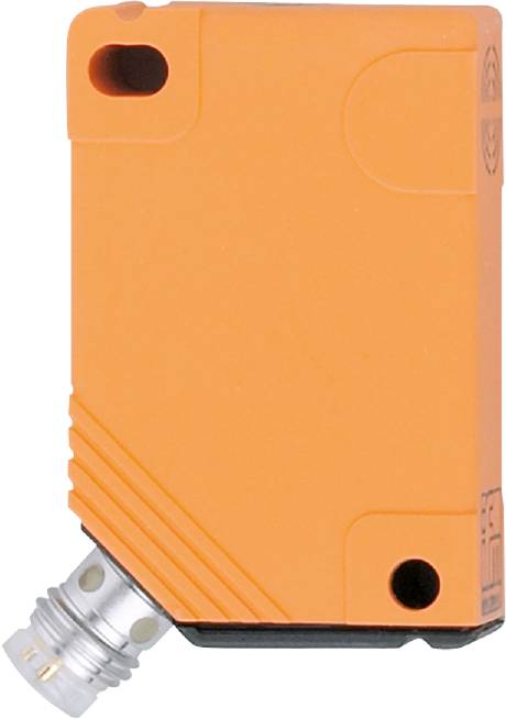 Nærbillede af en orangefarvet enhed med et sort hul og en sølvfarvet tilslutning forneden. Muligvis et teknisk modul eller sensor.