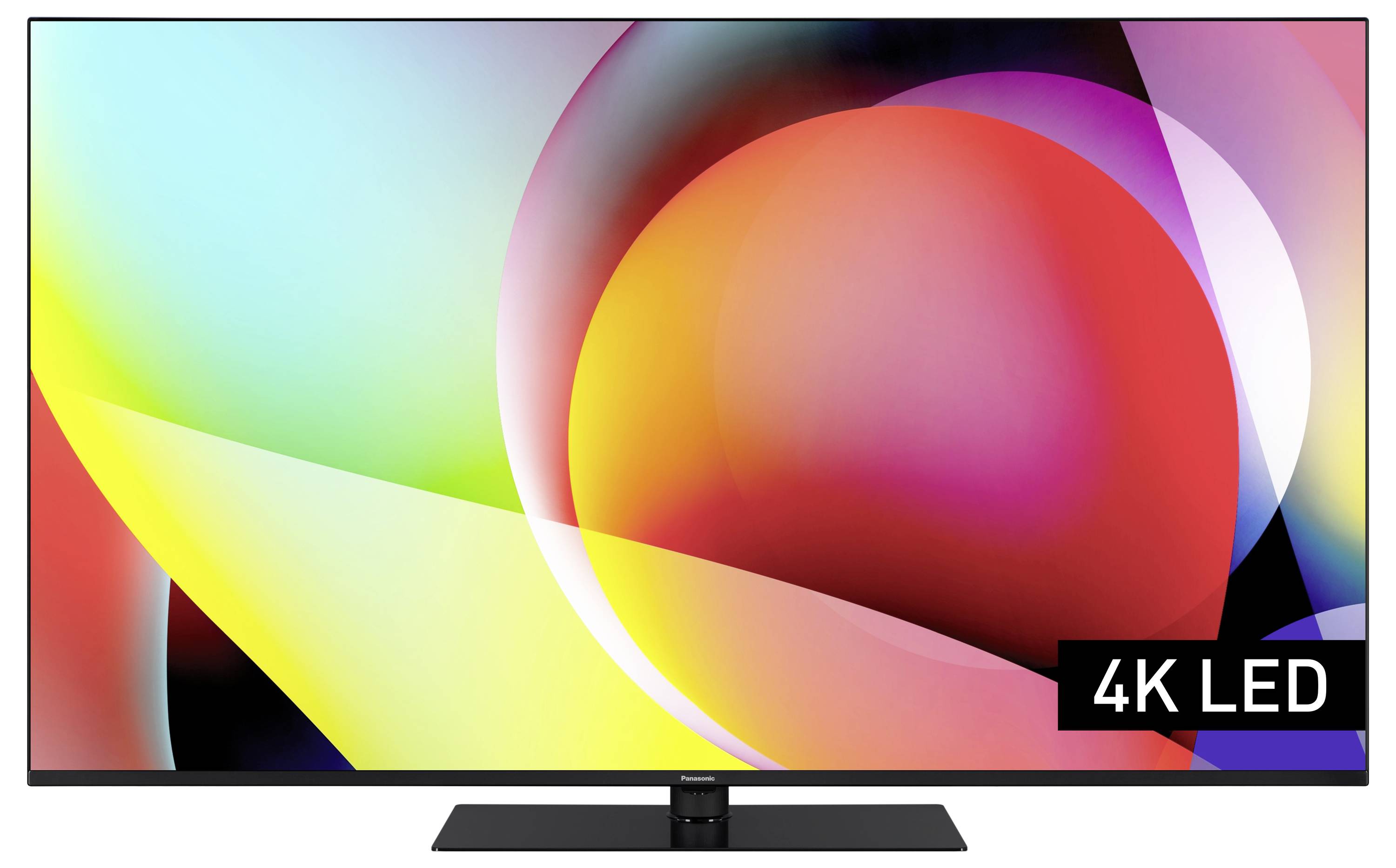 En fladskærms-tv viser farverige, abstrakte former. Nederst til højre er der et mærkat med teksten '4K LED'.