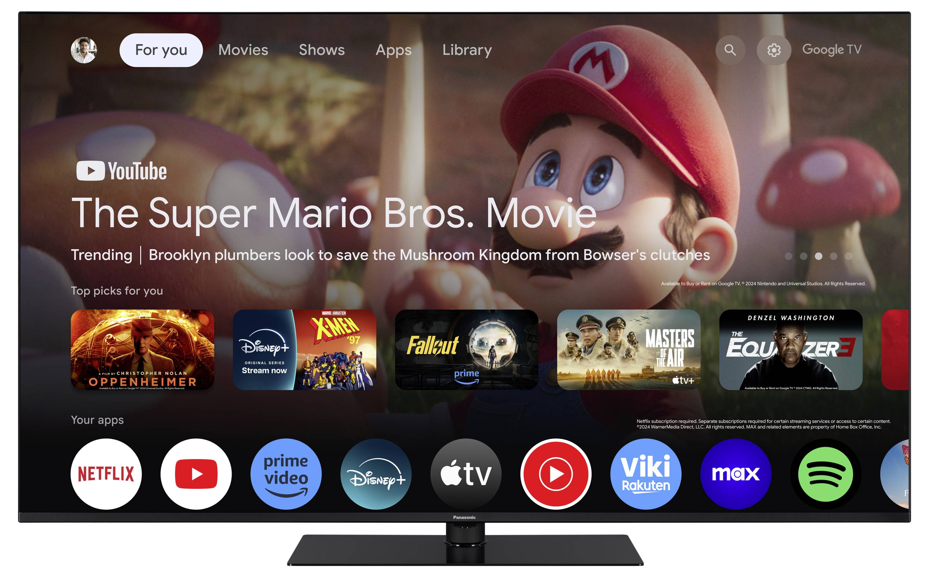 Billede af en tv-skærm med 'The Super Mario Bros. Movie' fremhævet på YouTube. Screenshot viser forskellige film-apps.