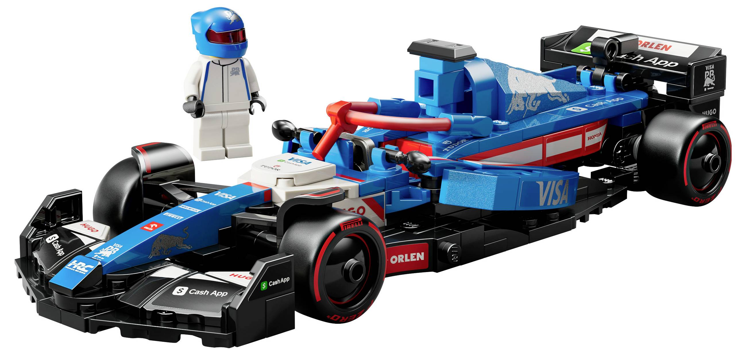 En LEGO Formel 1-bil i blå og rød farve med sponsorlogoer. En minifigur i en hvid racerdragt og blå hjelm står ved siden af.