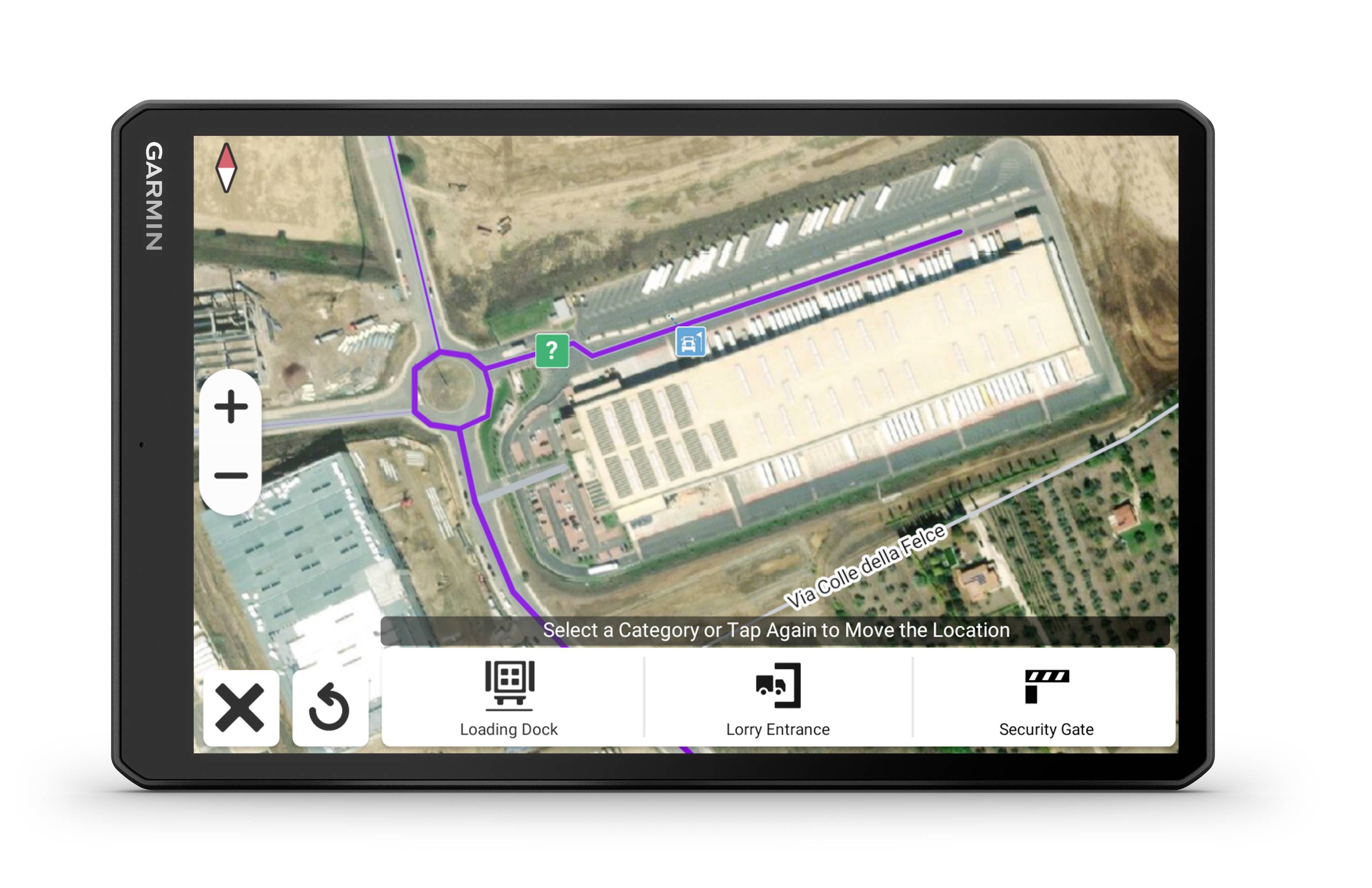 Et digitalt kort over et industrielt anlæg på en Garmin-enhed, viser adgangsveje og markeringer for 'læsseområde' og 'sikkerhedsport'.