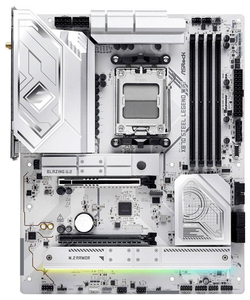 Et bundkort med flere slots, porte og stik, herunder RAM-slots, en CPU-sokkel og mærket 'X670E Steel Legend WiFi'.