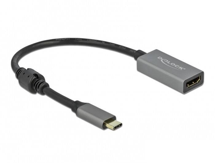 USB-C til HDMI-adapter med grå kabinet, egnet til at forbinde en USB-C-enhed med en HDMI-kompatibel skærm.