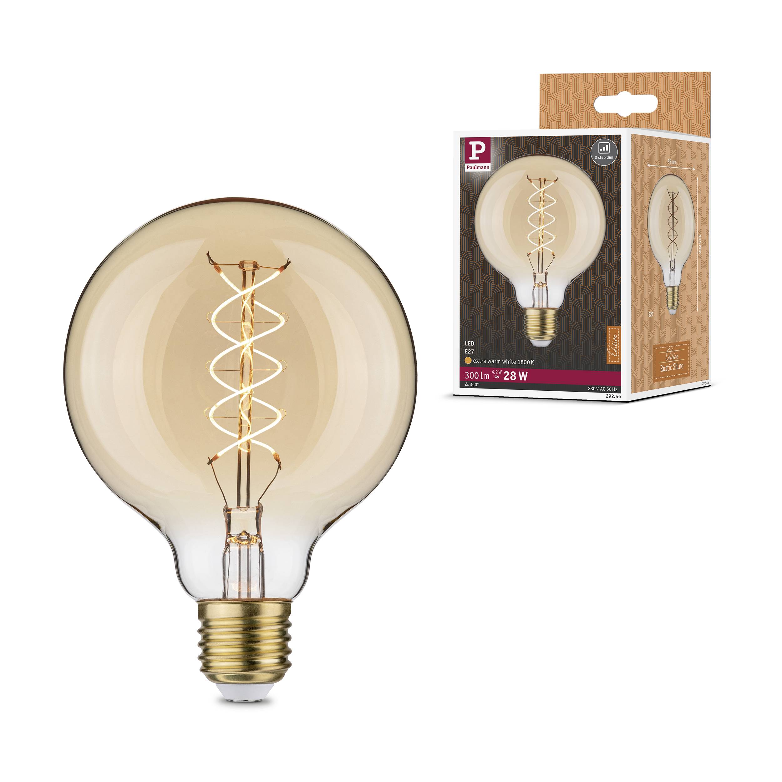 En LED-pære med synlig glødetråd i et transparent glasrør. Ved siden af ligger indpakningen med et billede af pæren.