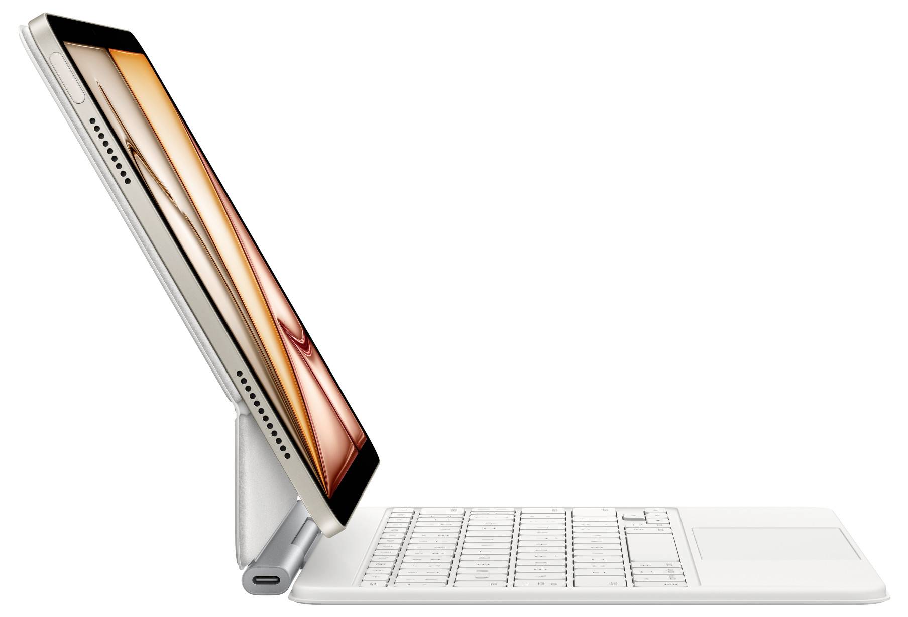Et tablet med sølvfarvet kabinet er tilsluttet et hvidt tastaturetui. Tabletten står i en fast vinkel.