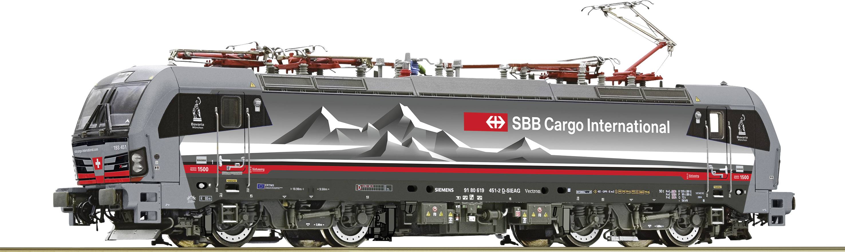 En grå SBB Cargo International lokomotiv med et bjergmotiv på siden.