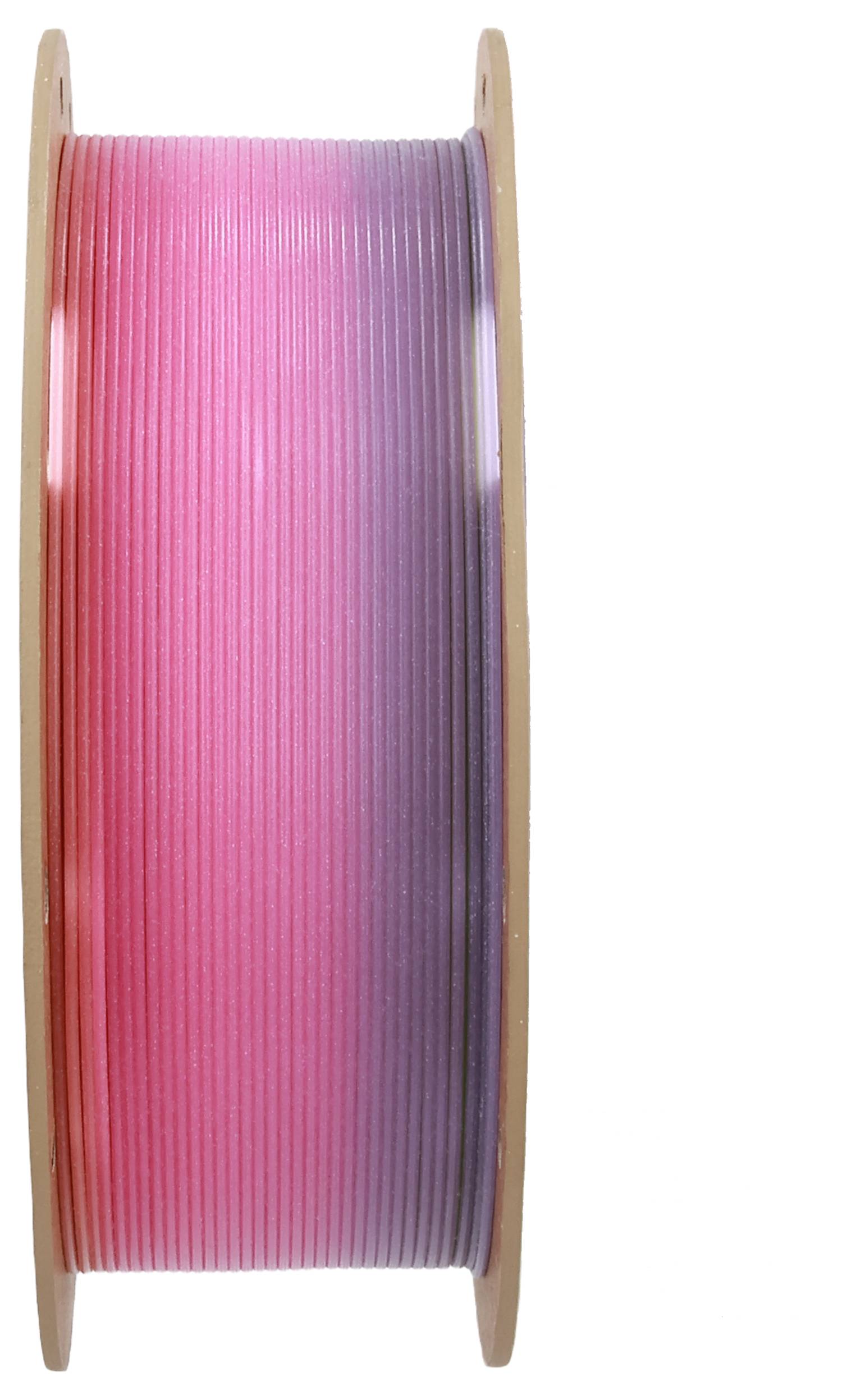 Spole med 3D-printer-filament i farveovergang fra pink til lilla, på en trærulle.