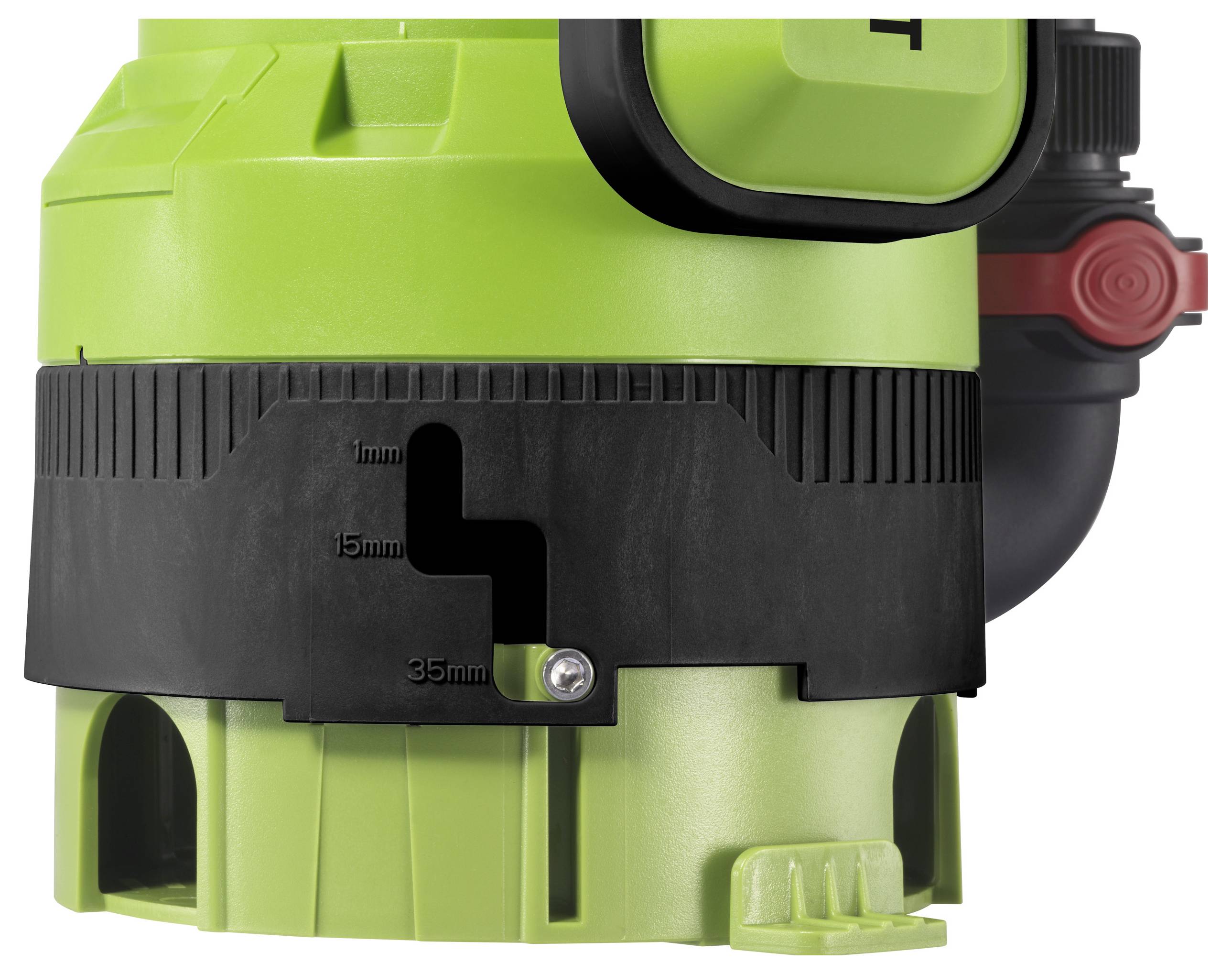 Grøn maskine med sort plastikdel, hvorpå målene 1 mm, 15 mm, 35 mm er angivet. Del af et større apparat.