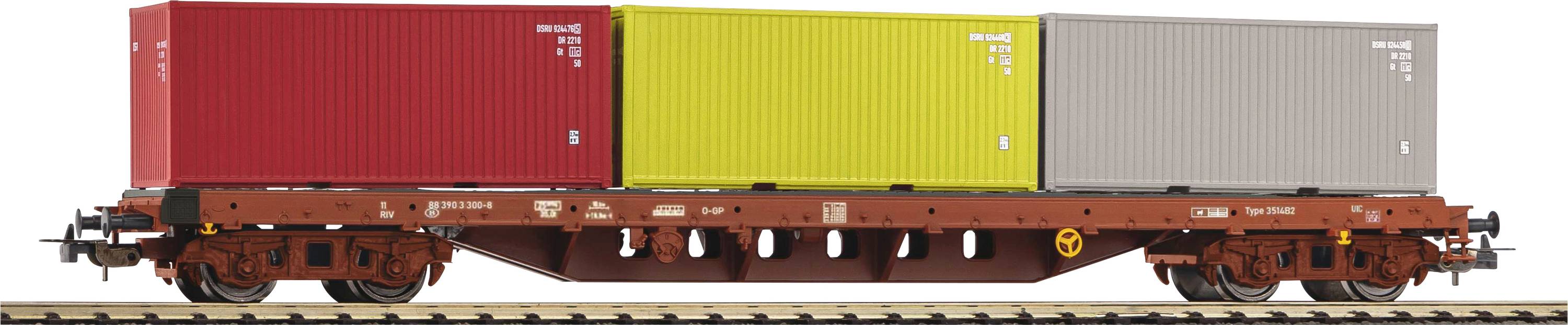 Godstog med tre farvede fragtcontainere, rød, gul og grå, på jernbaneskinner.