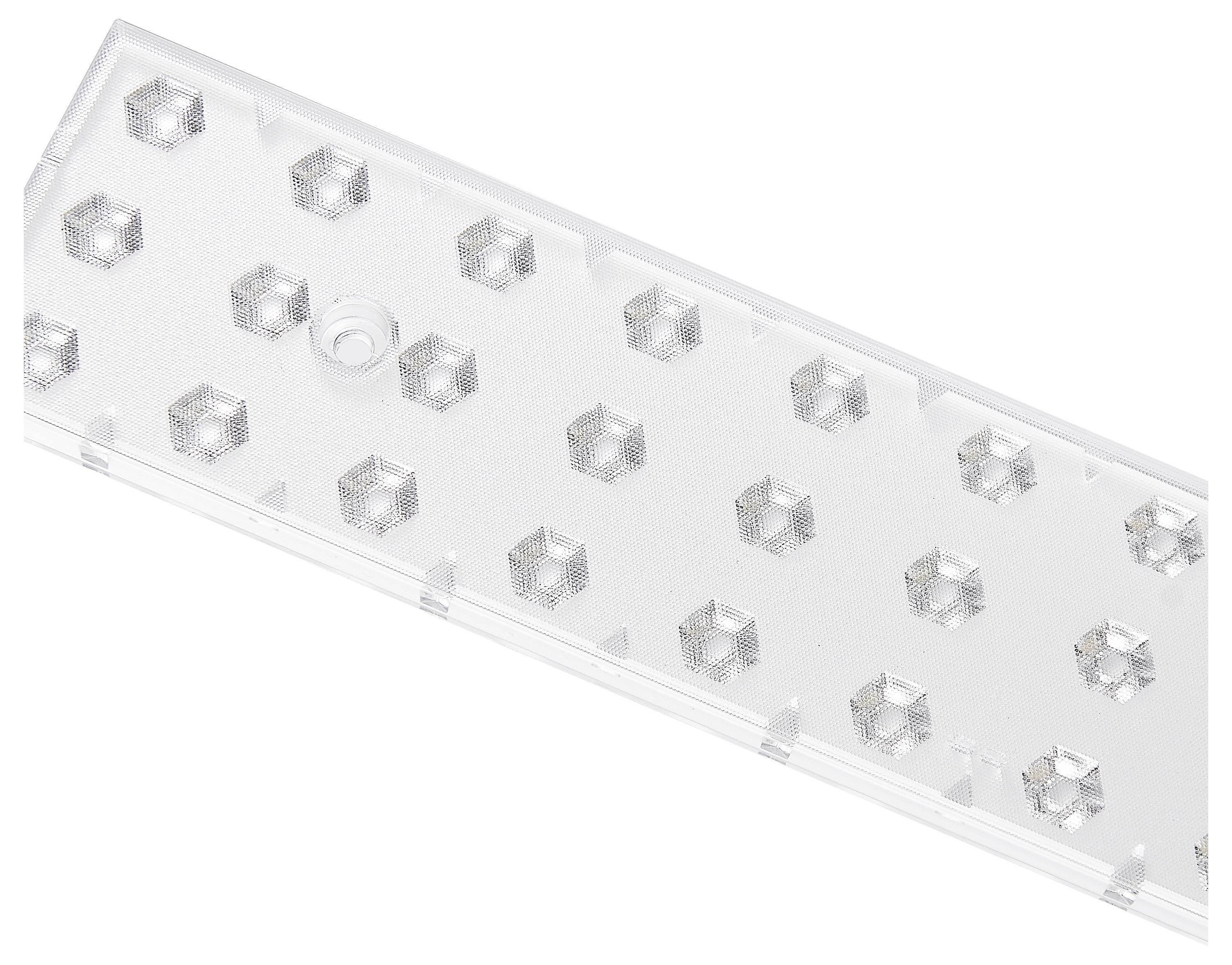 Et rektangulært, gennemsigtigt plastikstykke med ophøjede, sekskantet mønstre på.
