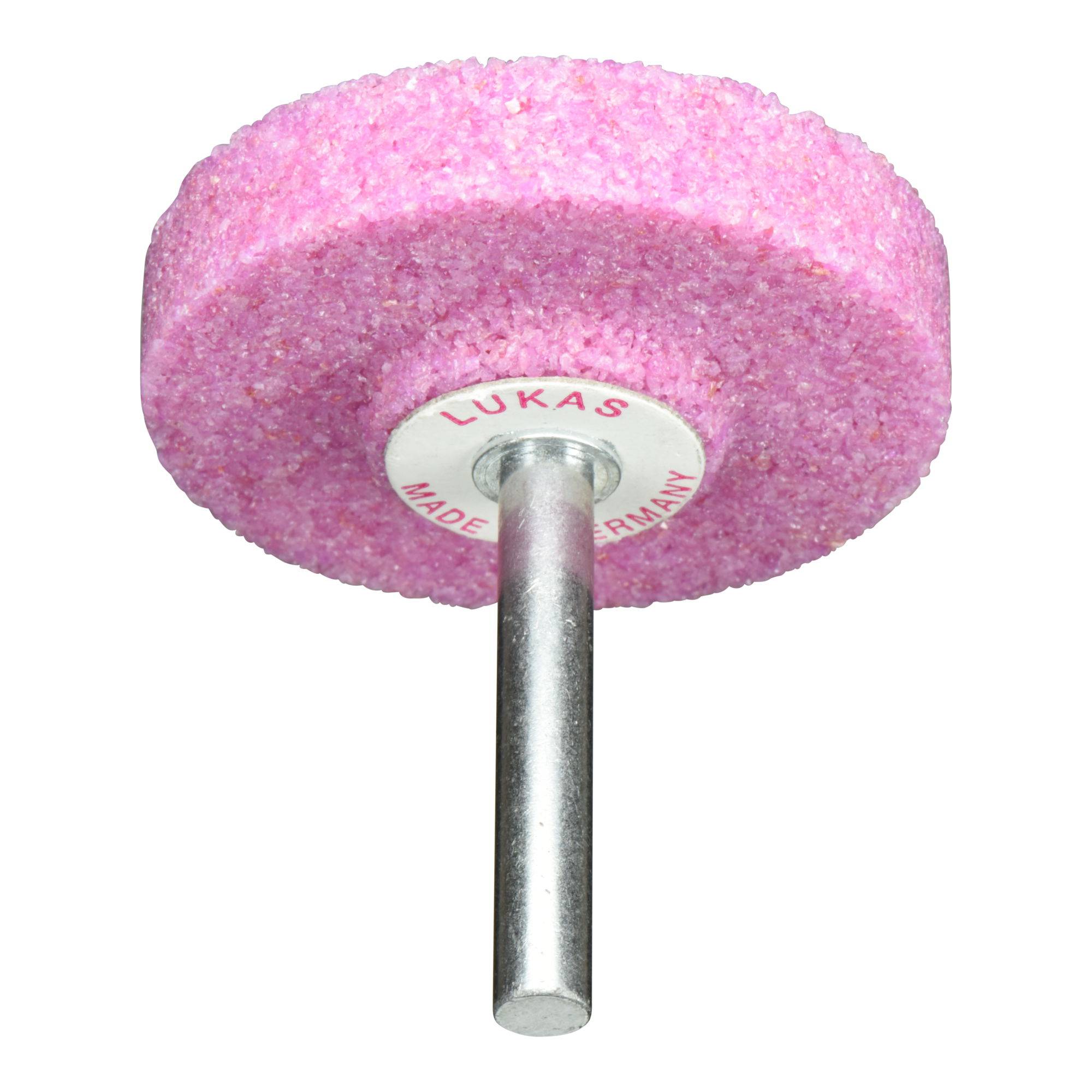 Et pink slibende kværn med en central metalaksel. Kværnen er mærket med 'LUKAS MADE IN GERMANY'.