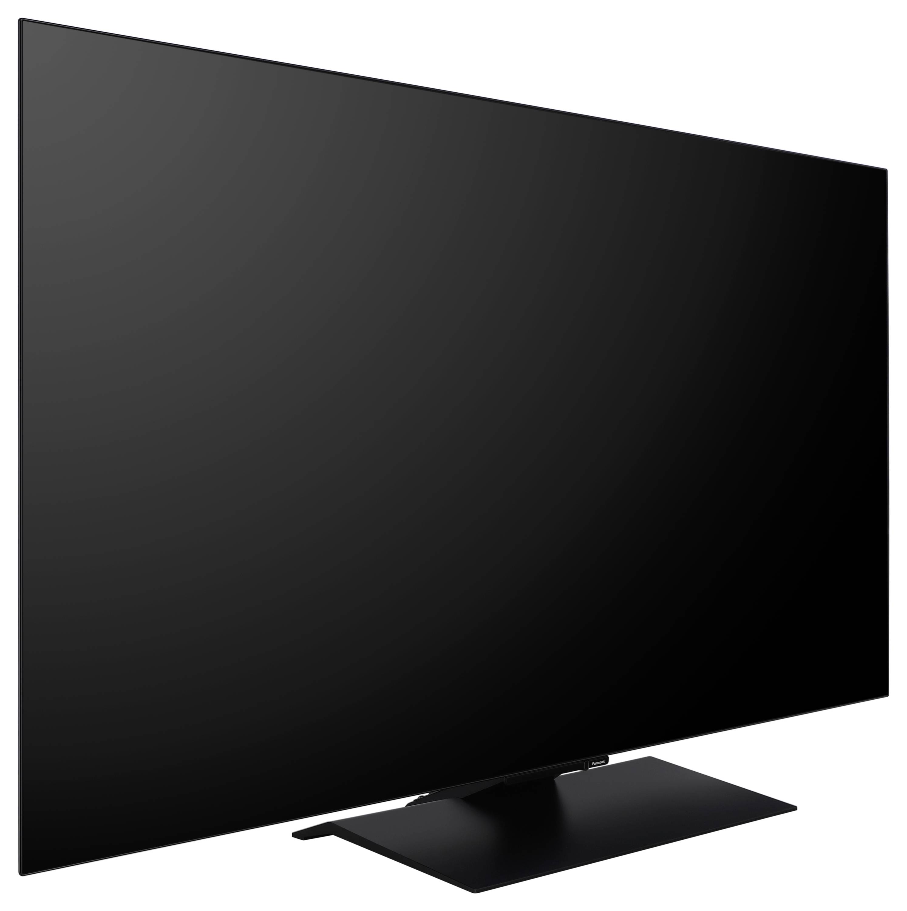 En elegant, stor fladskærms-tv med en tynd ramme, monteret på et rektangulært stativ, let vinklet mod højre foran en hvid baggrund.