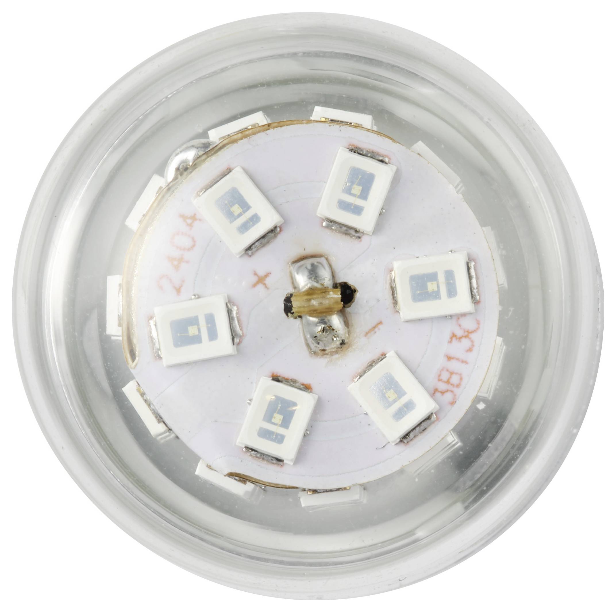 Et topview af en LED-klynge inde i en gennemsigtig cirkulær kasse, der viser seks jævnt fordelte LED-chips omkring en central akse.