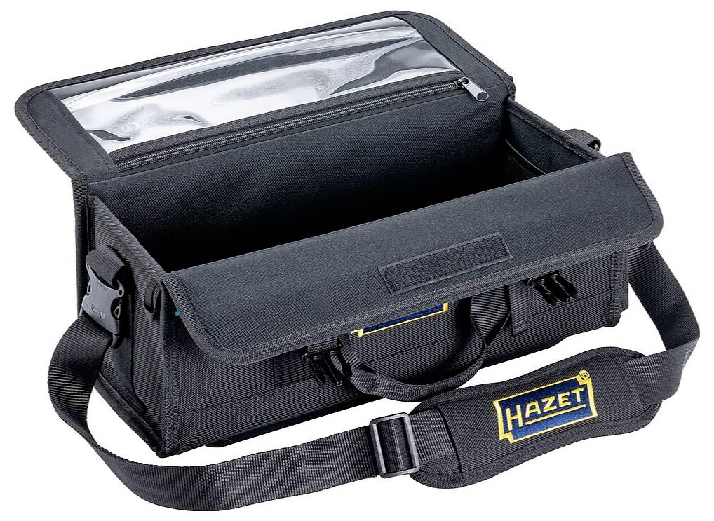En åben sort værktøjstaske med skulderrem, håndtag og en gennemsigtig lomme i låget. Mærket 'Hazet' er vist på forsiden.