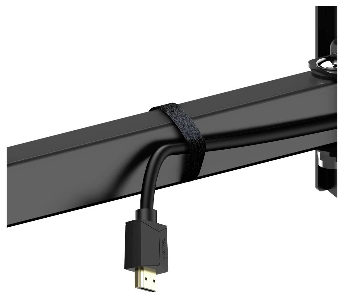 Sort kabelstrop, der sikrer et hængende HDMI-kabel til en sort bjælke eller monitorarm på hvid baggrund.