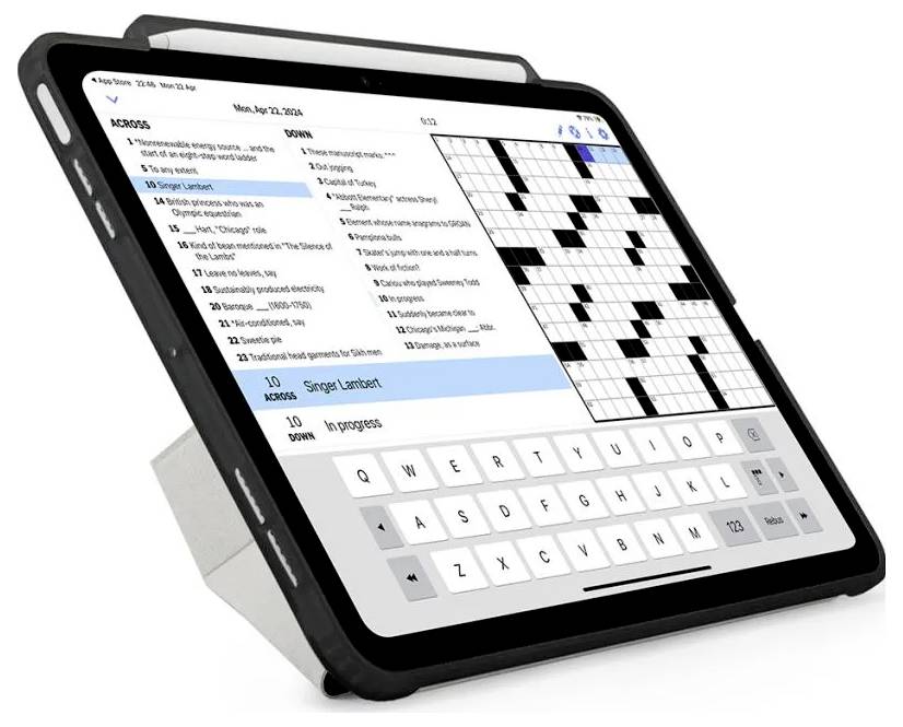 Tablet med en crossword-puslespils-app, der viser en ordliste til venstre og et delvist udfyldt gitter til højre, med et tastatur på skærmen nederst.