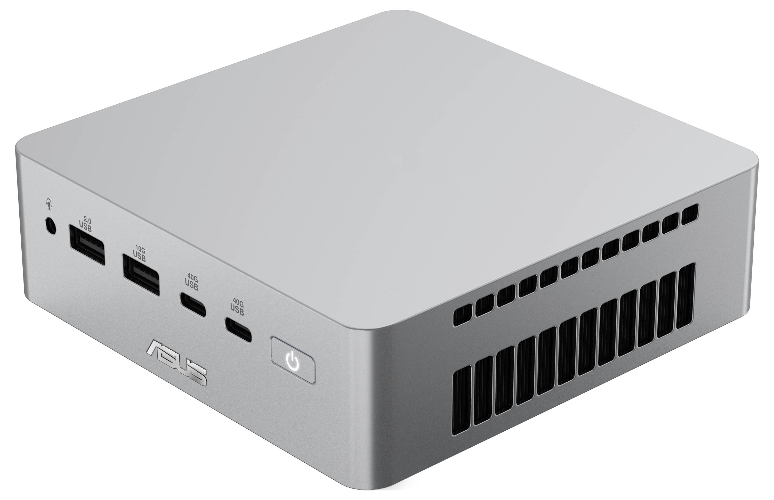 Lille sølvfarvet kompakt mini-PC med USB-porte på forsiden, audiojack, tænd/sluk-knap og ventilationsgitter på siden.