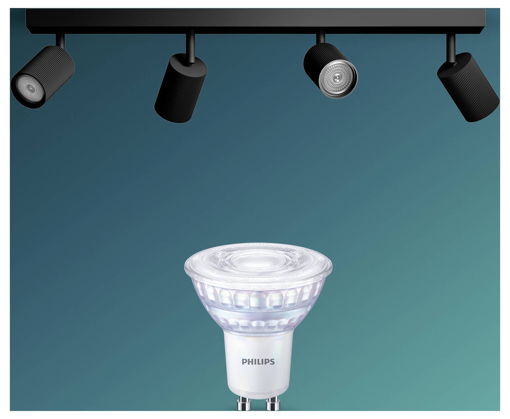 Philips LED spotlight-pære vist under fire loftsspotlights på en blågrøn baggrund.