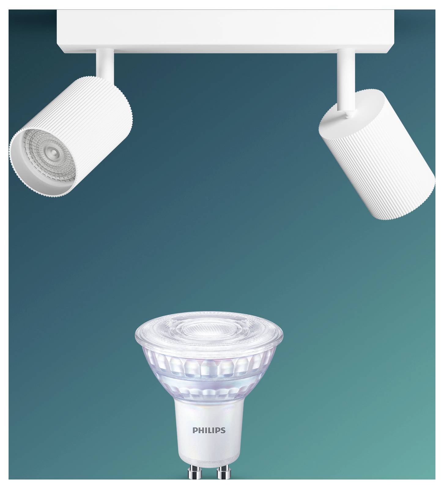 To hvide sporlamper skinner nedadrettet over en Philips spotlightpære centreret nedenfor på en teal baggrund.
