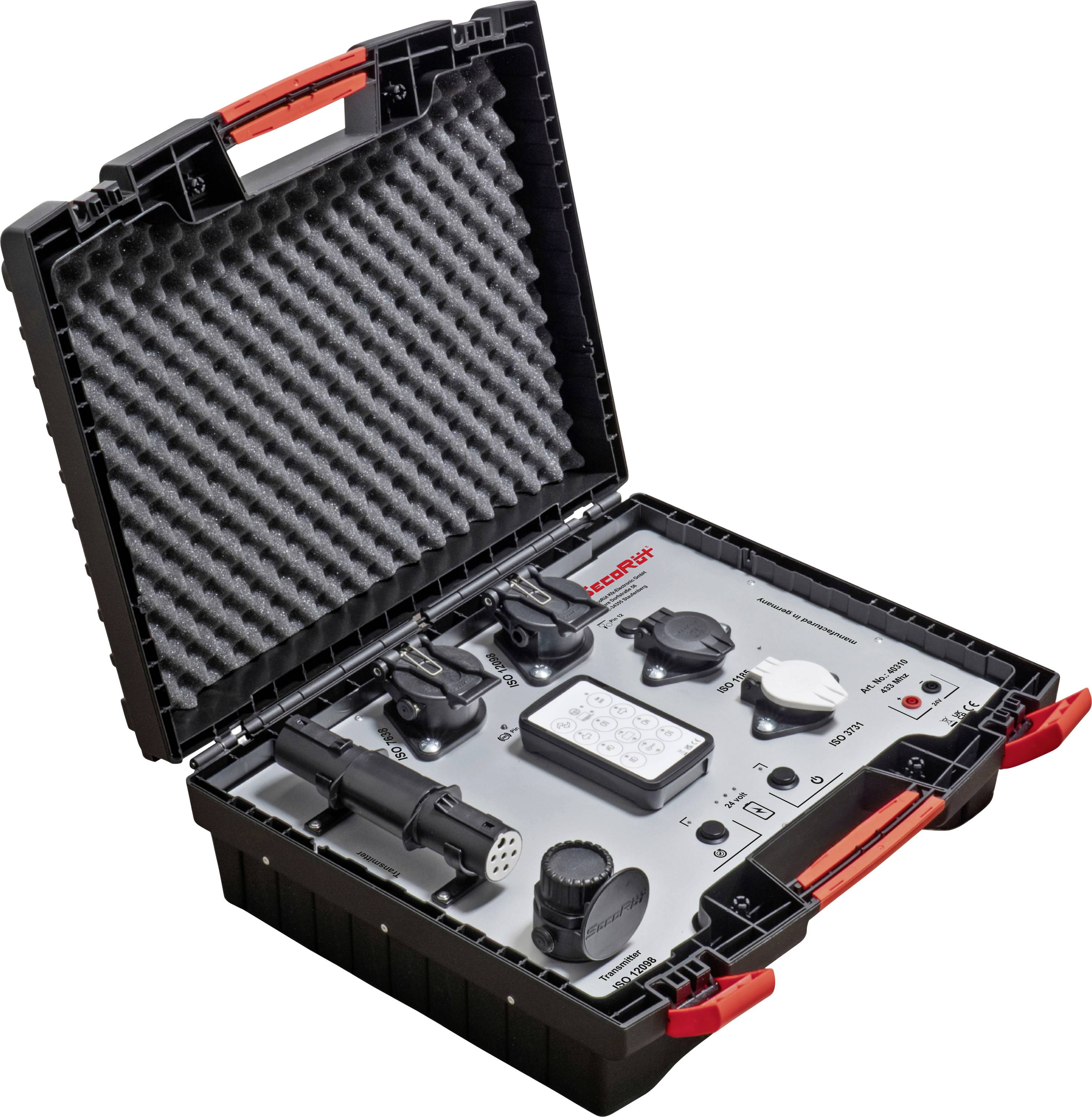 Åben sort hard case med skumudstyr indeholdende et kontrolpanel, to håndkontroller, en headset-lignende enhed og andre elektroniske komponenter.