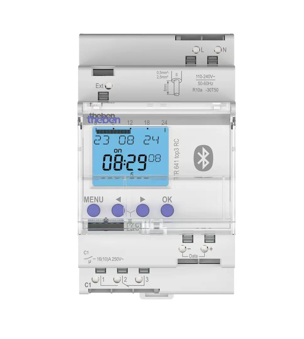 Digitalt vægur med timer-funktion og blåt LCD-display, der viser 08:29 og ugedagsindikator, fire knapper og Bluetooth-symbol.