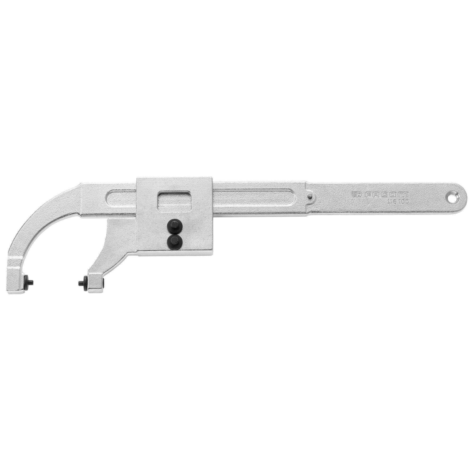 Metallig justerbar hulsehjælp med buet arm, glidende centerblok og cirkulært håndtagende på hvid baggrund.