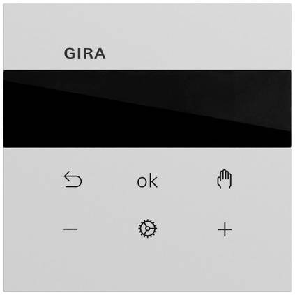 GIRA vægkontrolpanel med sort display og seks berøringsikonner: tilbage, ok, hånd, minus, indstillingsgear og plus.