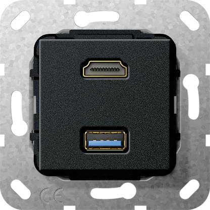 Vægmonteret sort stikkontakt med én HDMI-port over én USB-A-port på en grå metalplade.