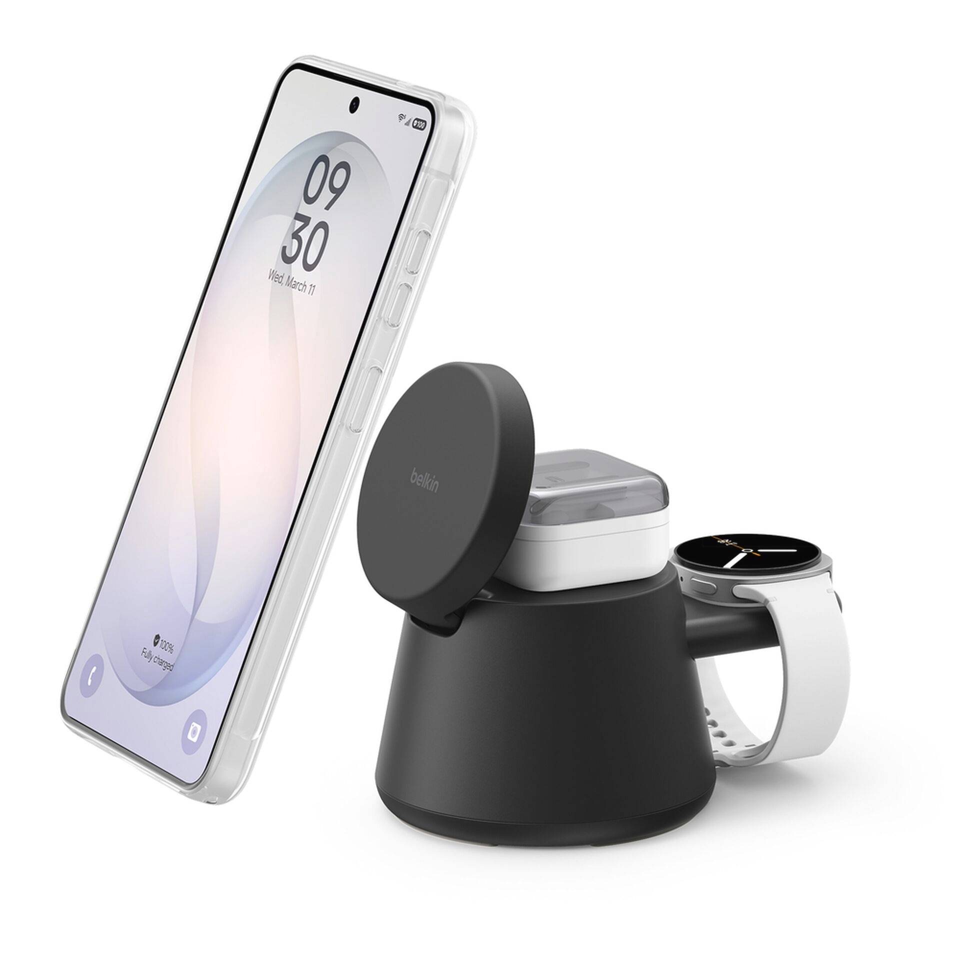 Trådløs opladningsstand, der holder en smartphone, øretelefoner-etui og smartwatch, og viser et multi-enhed-opladningssetup.